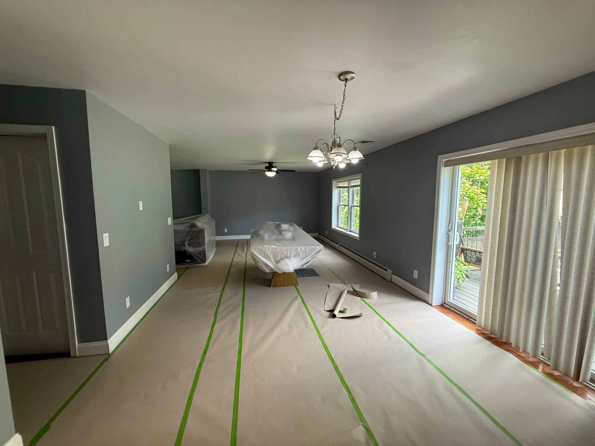 Floors papered and taped for a careful interior paint job