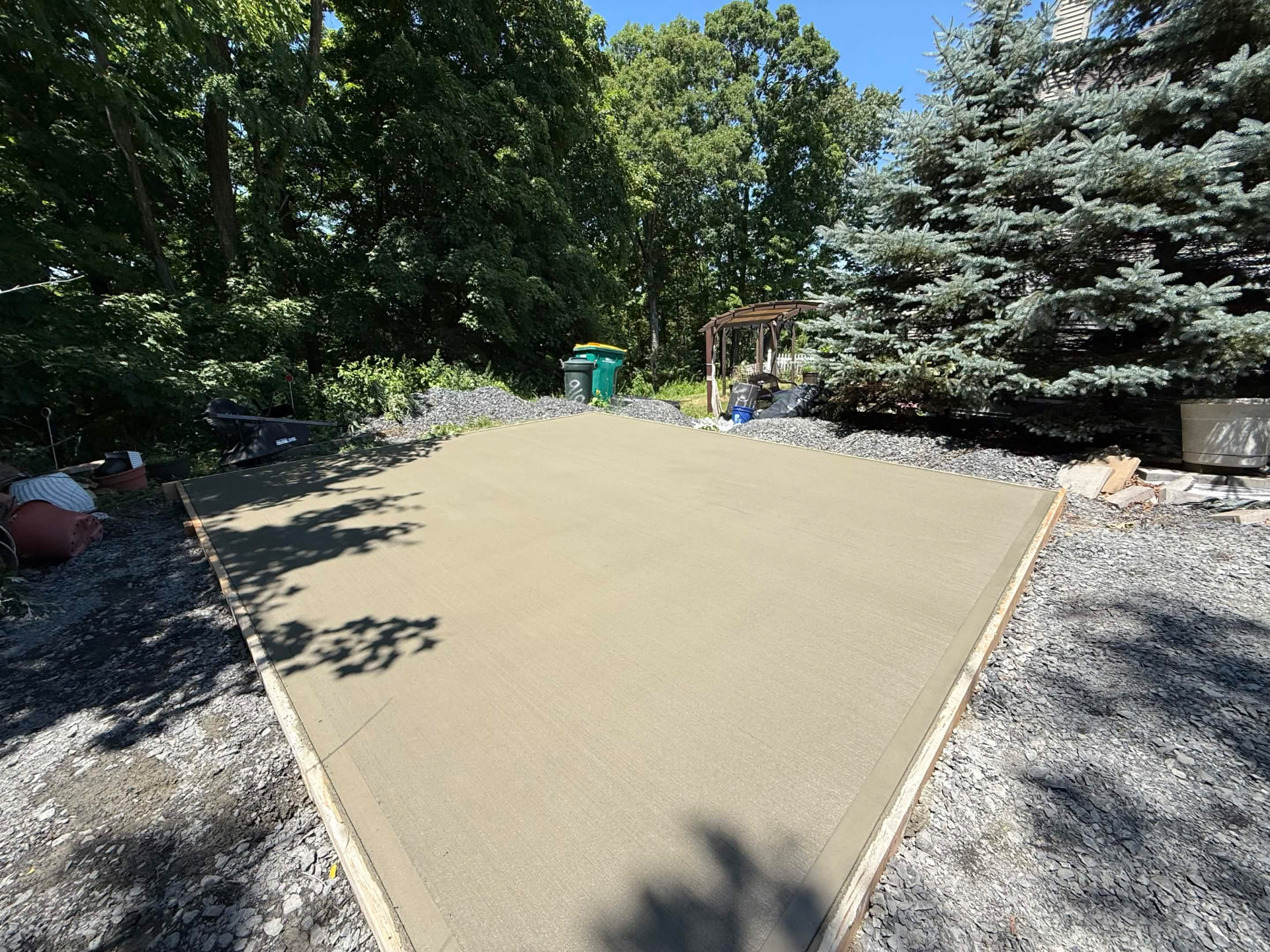 Large poured concrete pad set into a gravel base